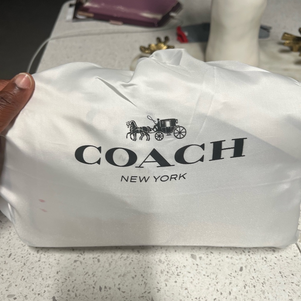 Coach cream color tabby bag.